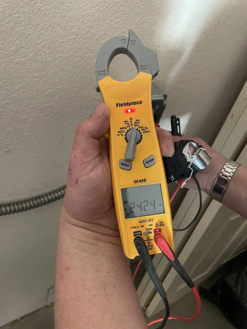 Voltage testing with clamp meter during Electrical Installation Services in Westport